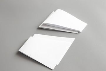 Blank portrait mock-up paper. brochure magazine isolated on gray, changeable background / white paper isolated on gray