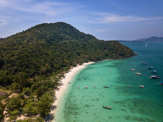 Aerial of cabin cruiser and speedboath on the big ocean in Andaman at koh He or Coral island, Phuket, Thailand