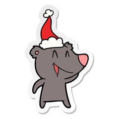 laughing bear sticker cartoon of a wearing santa hat