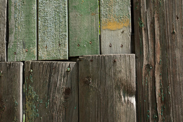 Wooden background with green paint residues. Abstract background