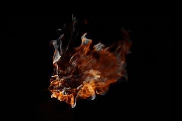 Flame and smoke on a black background.