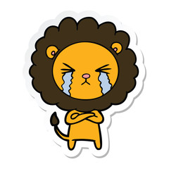 sticker of a cartoon crying lion