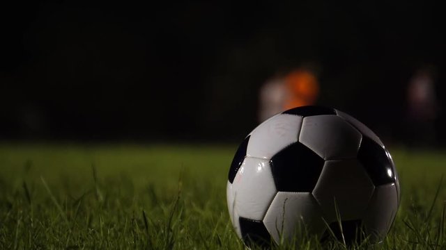 Close-up soccer ball on the floor after a football match footage 4K