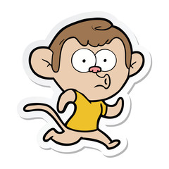 sticker of a cartoon hooting monkey