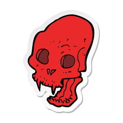 sticker of a cartoon spooky vampire skull