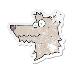 retro distressed sticker of a cartoon wolf head
