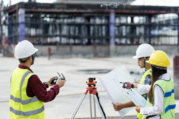 civil engineering flying drone over construction site survey for land and building project.