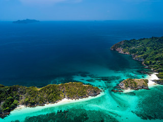 Aerial view of beautiful white sand beach and snorkel point at Cockburn island in Andaman sea near Ranong Thailand, Myanmar (Photo from Drone)