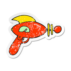 distressed sticker of a cartoon ray gun
