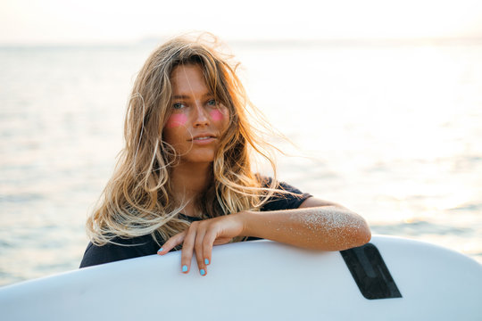 Surfer girl on beach