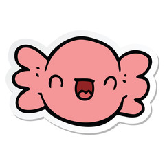 sticker of a cartoon wrapped candy