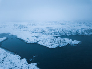 Shore Barents Sea. Kola Peninsula. Arctic Ocean winter landscape