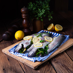 fresh trout with lemon and different herbs