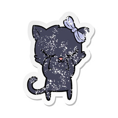 distressed sticker of a cute cartoon cat with bow