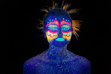 Blue woman portrait, aliens sleeps, ultraviolet make-up.  Beautiful on a dark background. Full face portrait