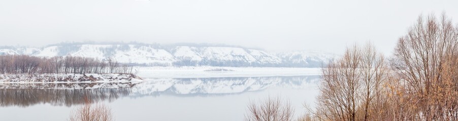 Panorama of the spring flood of the Oka River with a hilly coast, Russia