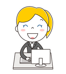 デスクトップパソコンの前に座っている黒いスーツの女性