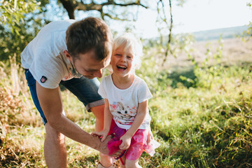 Happy Young  Family have a good time In The Park