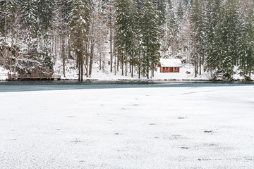 Snowfall on the Fusine lakes. Ghaccio and enchanting snow. Tarvisio, Friuli