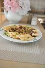 traditional Russian dish dumplings with potatoes bacon and fried onions