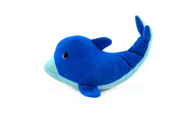 Stuffed blue dolphin doll isolated on white background.