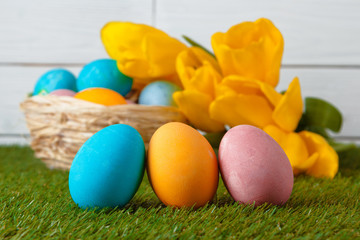 Fototapeta na wymiar Easter Eggs with flower on Green Grass