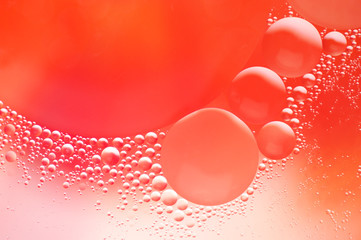 Coral colored abstract background with bubbles