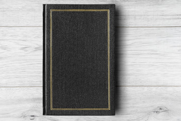 Fototapeta premium Book on wooden background