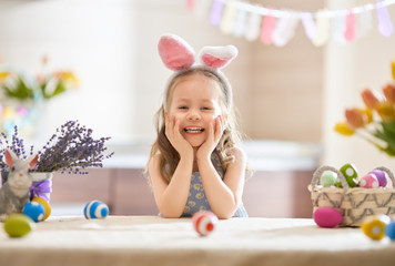 Girl with painted eggs