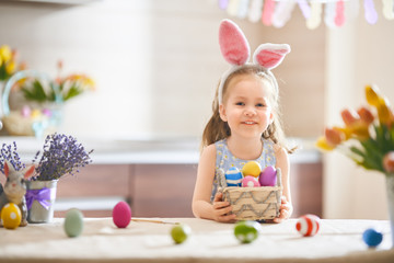 Girl with painted eggs