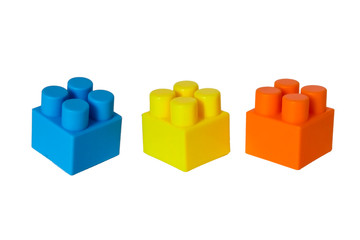 Obraz premium details of a children's plastic constructor on a white background. colored cubes. block.
