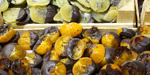 mandarins and kiwis covered with dark chocolate are an Italian s