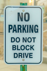 No Parking Do Not Block Drive road sign