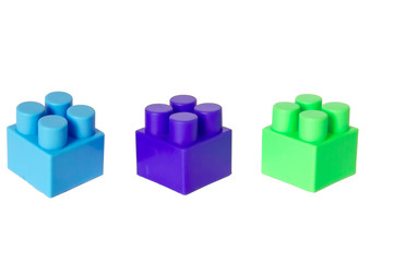 Obraz premium details of a children's plastic constructor on a white background. colored cubes. block.