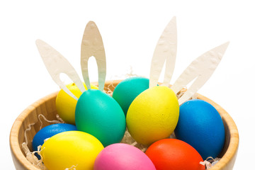 easter eggs with bunny ears in bowl isolated