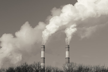 Stream of smoke from the chimney of factory. Toned image