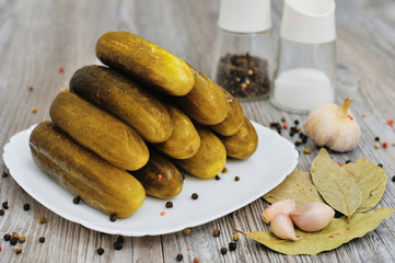 Pickled green cucumbers heap in the bowl