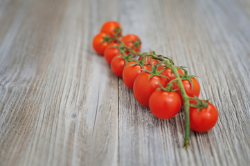 Cherry tomatoes isolated over white background