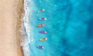Boats from air. Aerial view on sea in Turkey. Summer seascape with clear water in sunny day. Top view of boats from drone. Summer seascape from air. Travel - image