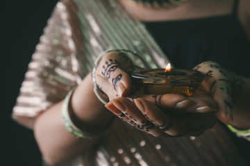 Woman holding Diwali candle
