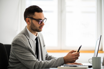 Fototapeta premium Young businessman is working in office. 