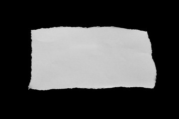 Ripped paper on black background, space for advertising copy.