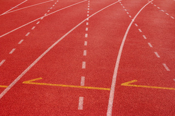 Fototapeta premium Red running track Synthetic rubber on the athletic stadium