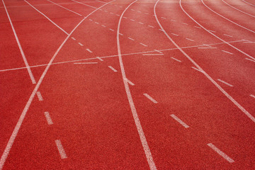 Fototapeta premium Red running track Synthetic rubber on the athletic stadium