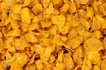 Honey and nut corn flakes breakfast cereal background