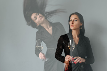 Double exposhure. Modern sommelier estimating smell of wine in wineglass. Forever young. Portrait of lovely brunettes with wine in hands on pink background