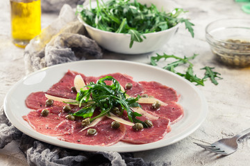 Beef carpaccio with arugula and parmesan