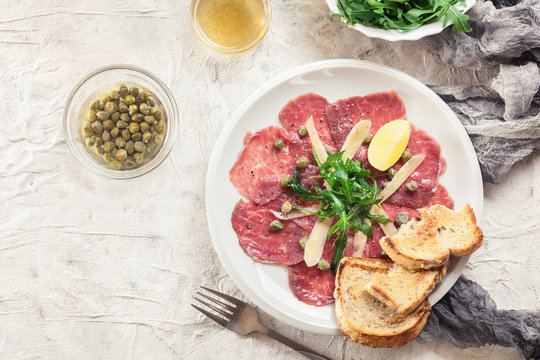 Beef carpaccio with arugula and parmesan
