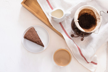 Breakfast with chocolate cake and coffee served on a beautiful living home