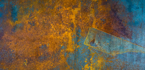 Aged steel plate. Industrial texture. Destructed metal surface with yellow corrosion traces.